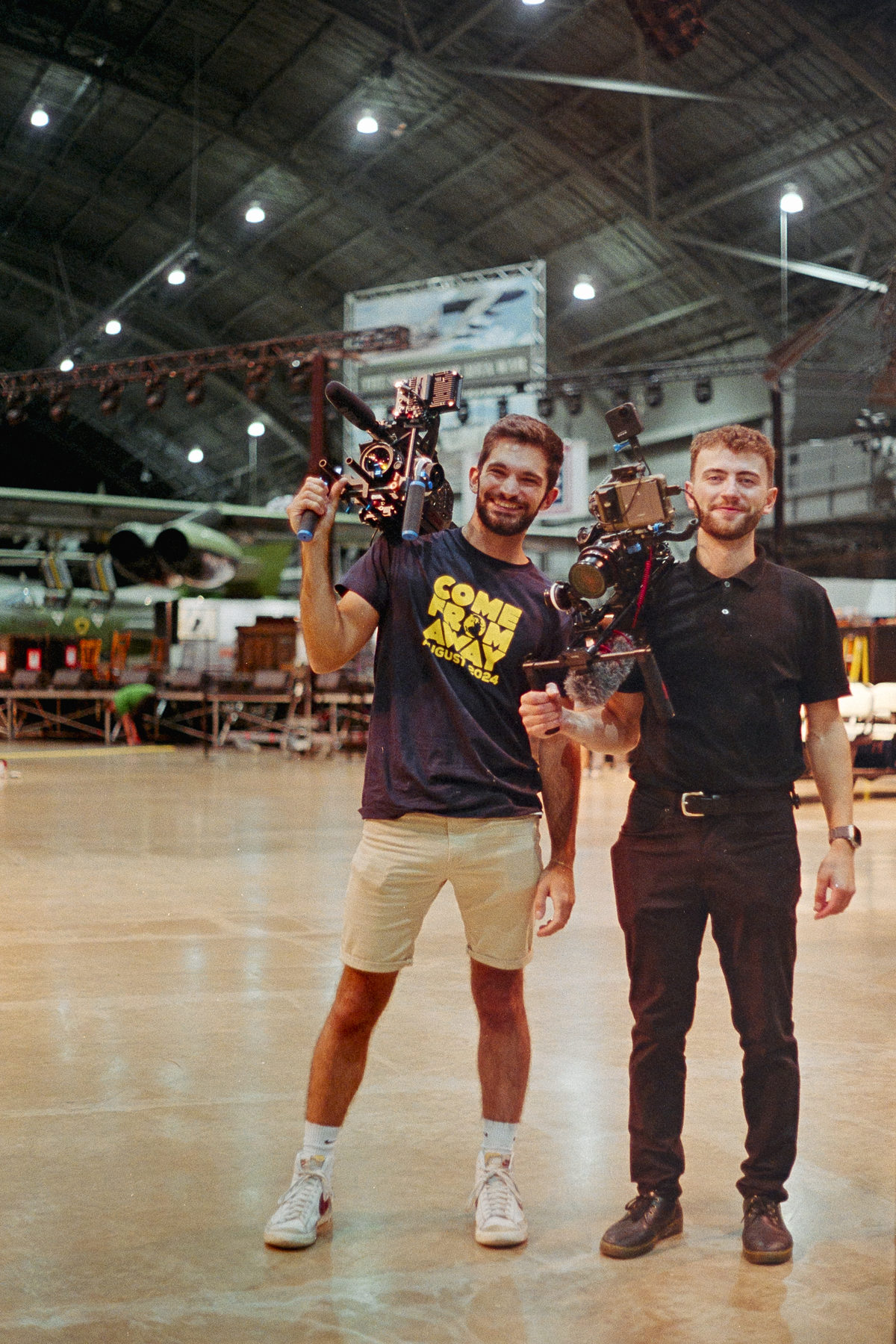 Tom Tranfaglia and a collaborator holding camera rigs on a film shoot